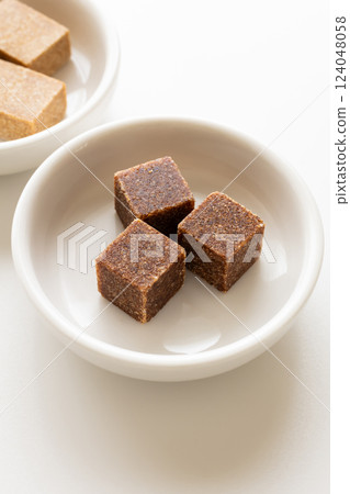 Bouillon, bouillon cubes, white background Bouillon, bouillon cubes, white background 124048058