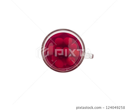 Sweet refreshing berry compote from ripe cherries in a glass isolated on white background. Sweet refreshing berry compote from ripe cherries in a glass isolated on white background. 124049258