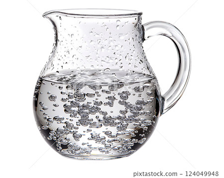 Crystalclear glass pitcher filled with sparkling water, capturing the beauty of effervescence.  Perfect for advertisements, websites, or healthrelated publications. 124049948