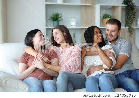 Two happy interracial couples lesbian and heterosexual at home Two happy interracial couples lesbian and heterosexual at home 124050089