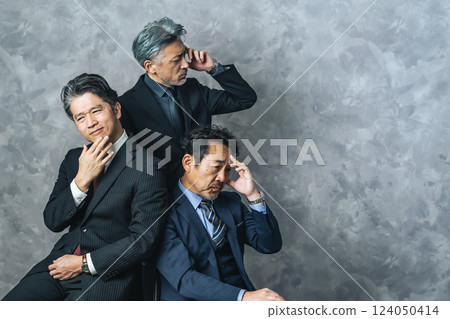 A group of thoughtful middle-aged male business people 124050414
