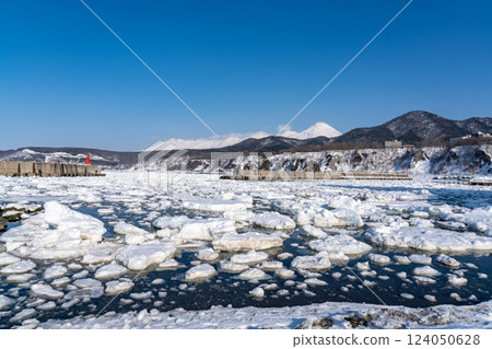 Drift ice ashore at Utoro fishing port on the Shiretoko Peninsula 124050628