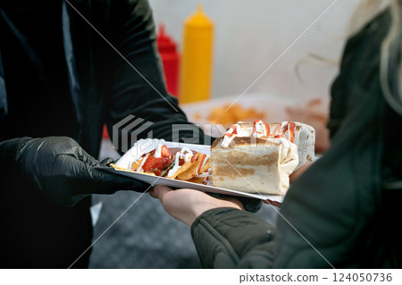 Street Food Vendor Handing Customer Mexican Dish 124050736