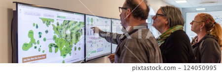 Eco-sustainable HR planning session featuring interactive digital boards showcasing carbon footprint reduction targets, green initiatives and sustainable practices in modern business operations. 124050995