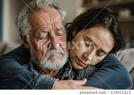 A caregiver providing emotional comfort to a grieving elderly person, underlining the empathetic and compassionate role in caregiving 124051023