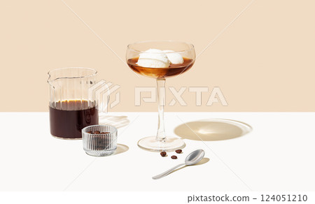 Affogato coffee with vanilla ice cream scoops and espresso in a tall glass on a beige background 124051210