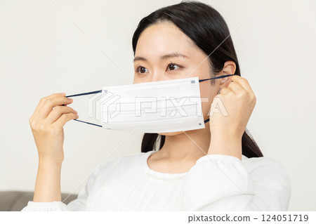 Asian woman wearing a mask 02 124051719