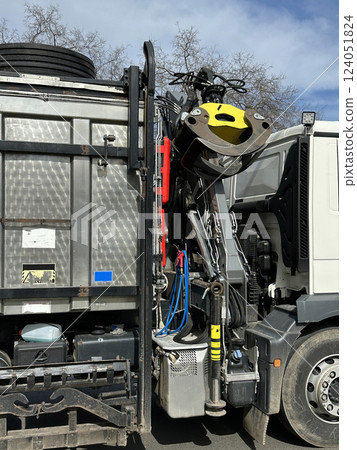 Side view of the garbage truck with crane 124051824