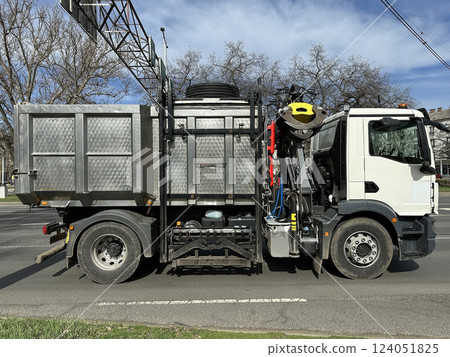 Garbage truck transporting dangerous materials 124051825