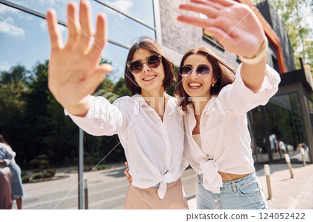 In sunglasses. Two female friends have great weekend outdoors together 124052422