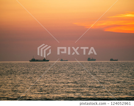 A ship floating on the sea at sunset A ship floating on the sea at sunset 124052961