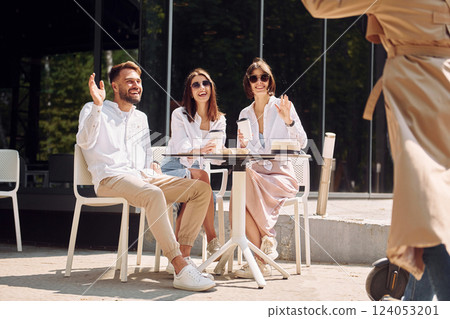 Having a conversation. Three friends having great weekend outdoors together Having a conversation. Three friends having great weekend outdoors together 124053201