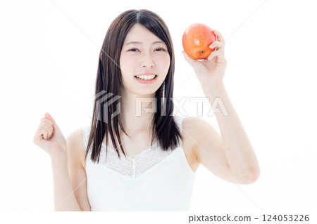 A woman eating an apple A woman eating an apple 124053226