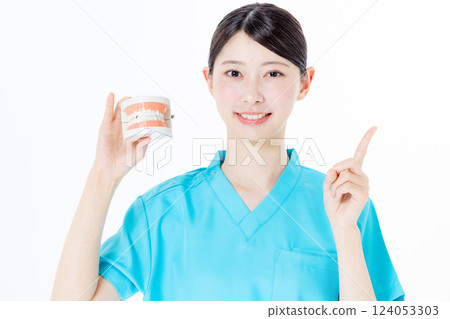 Female nurse wearing scrubs/dental hygienist Female nurse wearing scrubs/dental hygienist 124053303