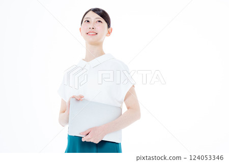 A smiling woman with a personal computer A smiling woman with a personal computer 124053346