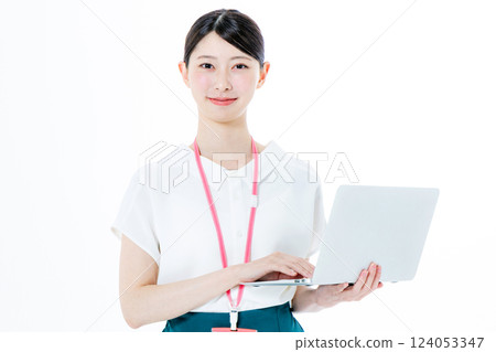 A smiling woman with a personal computer 124053347