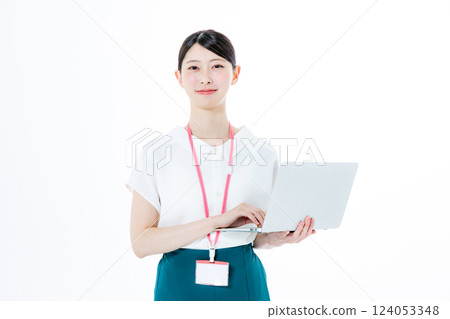 A smiling woman with a personal computer 124053348