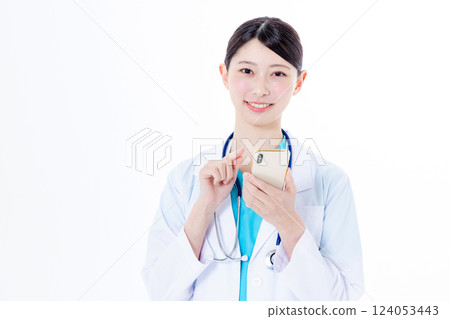Female doctor using a smartphone 124053443