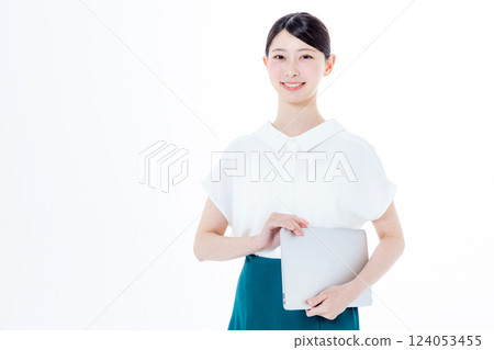 A smiling woman with a personal computer 124053455