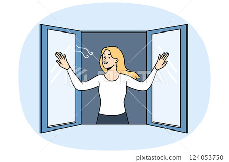 Woman opens window enjoying fresh air coming from street in house, and smilingly looks at passers-by 124053750