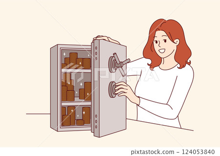 Woman accumulates capital by putting gold coins in safe to become rich and independent Woman accumulates capital by putting gold coins in safe to become rich and independent 124053840