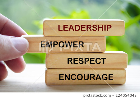 Leadership, empower, respect and encourage text on wooden blocks. Leadership concept. Leadership, empower, respect and encourage text on wooden blocks. Leadership concept. 124054042