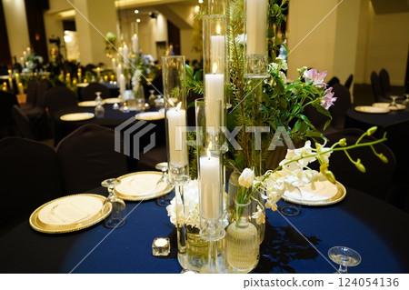 Wedding table setting with candles, flowers and cutlery Wedding table setting with candles, flowers and cutlery 124054136