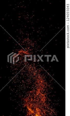 Hot sparks flying in the air isolated on black background 124055043