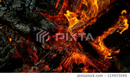 Close-up of Hot Embers with Flying Sparks . Concept of heating grills or ovens Close-up of Hot Embers with Flying Sparks . Concept of heating grills or ovens 124055048