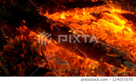 Close-up of Hot Embers with Flying Sparks . Concept of heating grills or ovens Close-up of Hot Embers with Flying Sparks . Concept of heating grills or ovens 124055070