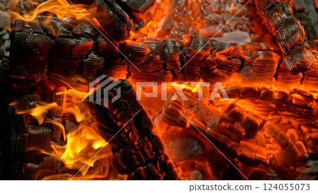 Close-up of Hot Embers with Flying Sparks . Concept of heating grills or ovens Close-up of Hot Embers with Flying Sparks . Concept of heating grills or ovens 124055073