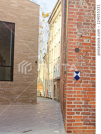 Architectural Contrast: Modern and Old Brick Buildings, Narrow Alleyway, Urban Scene, Textures. High quality photo Architectural Contrast: Modern and Old Brick Buildings, Narrow Alleyway, Urban Scene, Textures. High quality photo 124055331