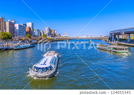 A rare view of the Tokyo cityscape in Japan. Three water buses, including Emeraldas, Ajisai (foreground), and Dokan, lined up at the Asakusa water bus terminal 124055345