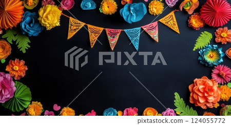 Dark background framed with colorful paper flowers and string of patterned pennants. Festive, handmade decorations create vibrant border with copy space. 124055772