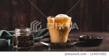 Delicious sweet affogato coffee with creamy ice cream in a cup on the table web banner 124055802
