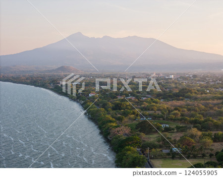 Scenic view of a tranquil lake with mountains during early morning light 124055905