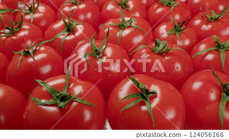 A Beautiful Display of Fresh Red Tomatoes at the Local Market, Full of Vibrant Colors 124056168