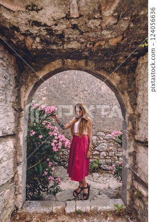 Woman Standing in Arch in Old Himara Castle 124056636