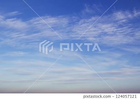 Blue sky with beautiful white clouds. Sky with cumulus and cirrocumulus clouds. Panoramic image of the sky. Blue sky with beautiful white clouds. Sky with cumulus and cirrocumulus clouds. Panoramic image of the sky. 124057121
