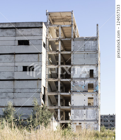 old USSR factory exterior, industry building is in a state of disrepair 124057333