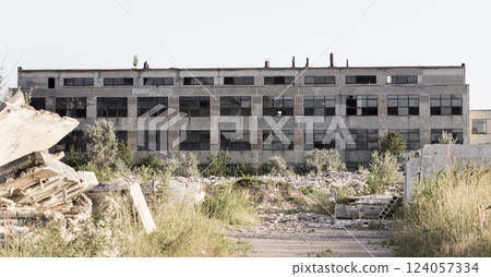 old USSR factory exterior, industry building is in a state of disrepair 124057334