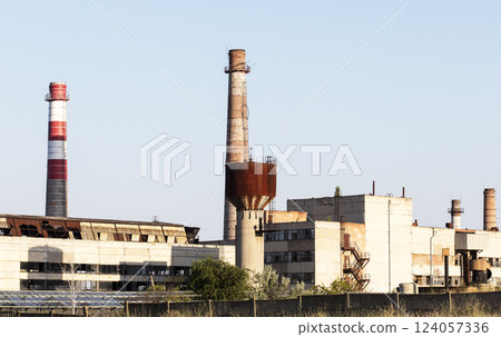 old USSR factory exterior, industry building is in a state of disrepair old USSR factory exterior, industry building is in a state of disrepair 124057336