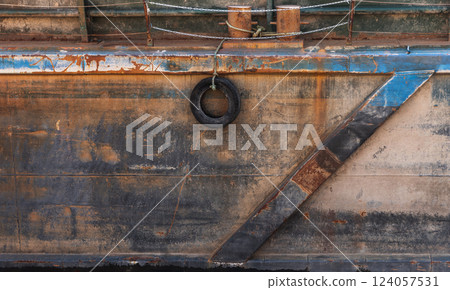 Detailed view of an aged ship hull with rusted sections 124057531