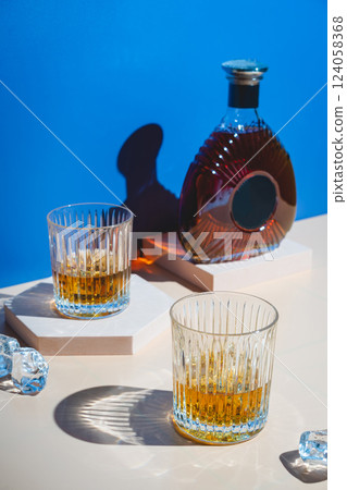 Whiskey with ice in glasses Whiskey with ice in glasses 124058368
