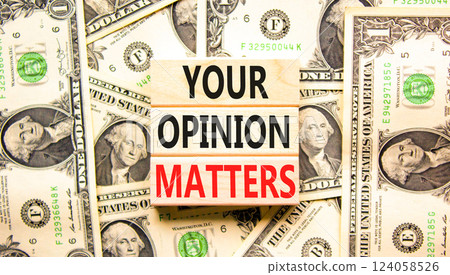 Your opinion matters symbol. Concept words Your opinion matters on beautiful wooden blocks. Dollar bills. Beautiful background from dollar bills. Business your opinion matters concept. Copy space. 124058526