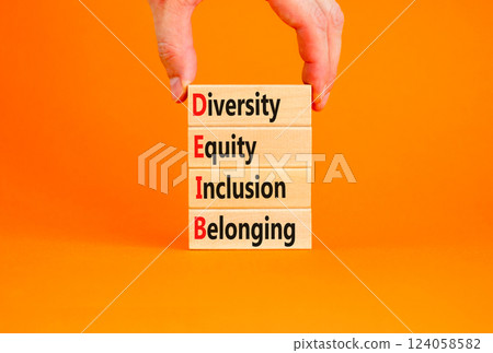 DEIB diversity equity inclusion belonging symbol. Concept words DEIB diversity equity inclusion belonging on blocks. Beautiful orange background. Business diversity equity inclusion belonging concept. DEIB diversity equity inclusion belonging symbol. Concept words DEIB diversity equity inclusion belonging on blocks. Beautiful orange background. Business diversity equity inclusion belonging concept. 124058582