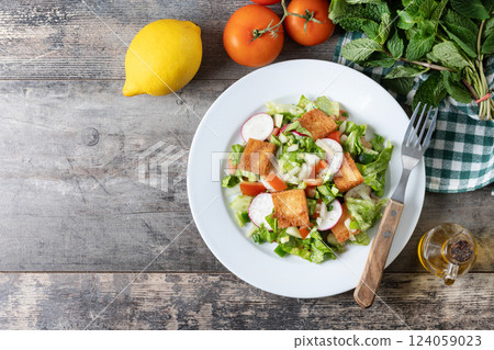 Fattoush, Traditional Lebanese Salad. on wooden table Fattoush, Traditional Lebanese Salad. on wooden table 124059023