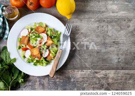Fattoush, Traditional Lebanese Salad. on wooden table 124059025