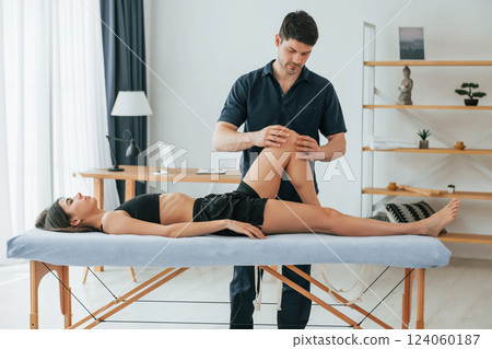 On the table. Woman visiting physiologist that making massages and helping with traumas On the table. Woman visiting physiologist that making massages and helping with traumas 124060187