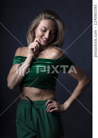 portrait of a young beautiful woman on a dark background 124060395